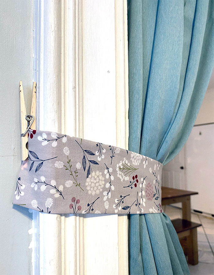 DIY curtain tie back using clothespin and pretty fabric