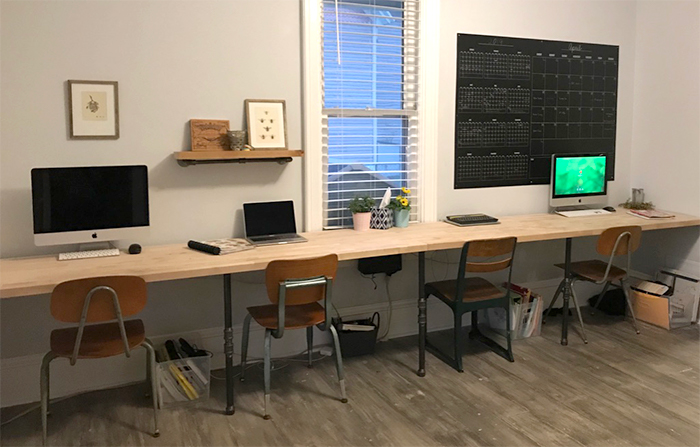 Pretty homeschool room with long tables for four students