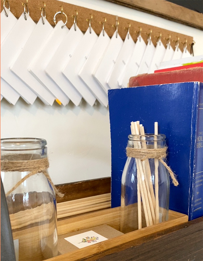 Glass bottles and skewers for teaching place value 