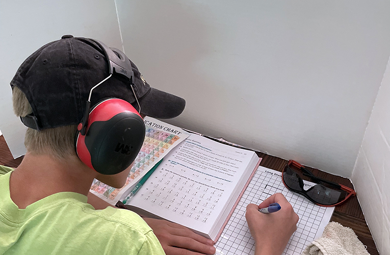 Using headphones and a science board to help focus when homeschooling with ADHD
